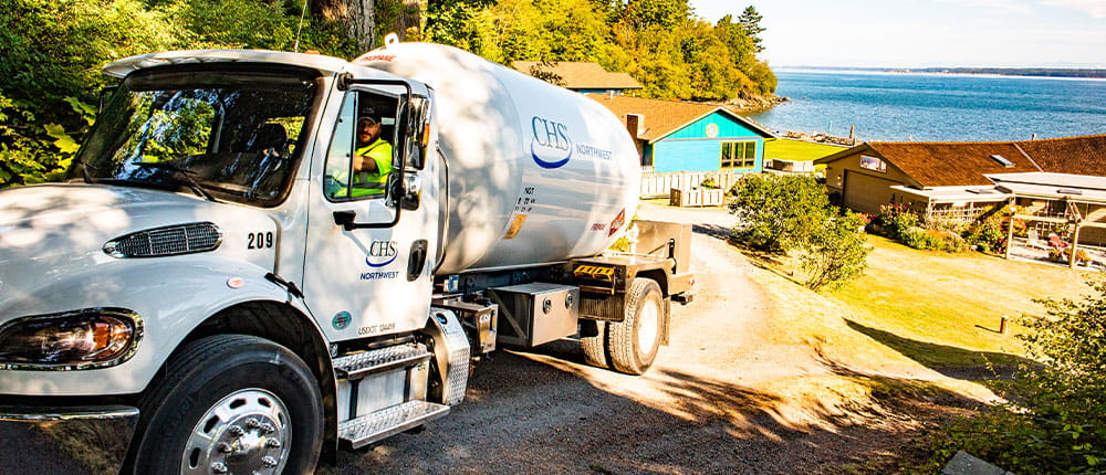 Propane truck backing down driveway